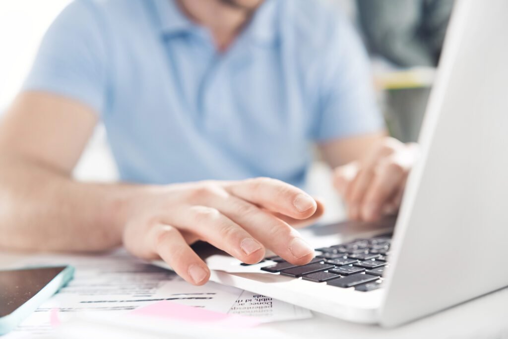 Man at a laptop building links for a client